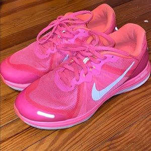 Pink Nike running shoes